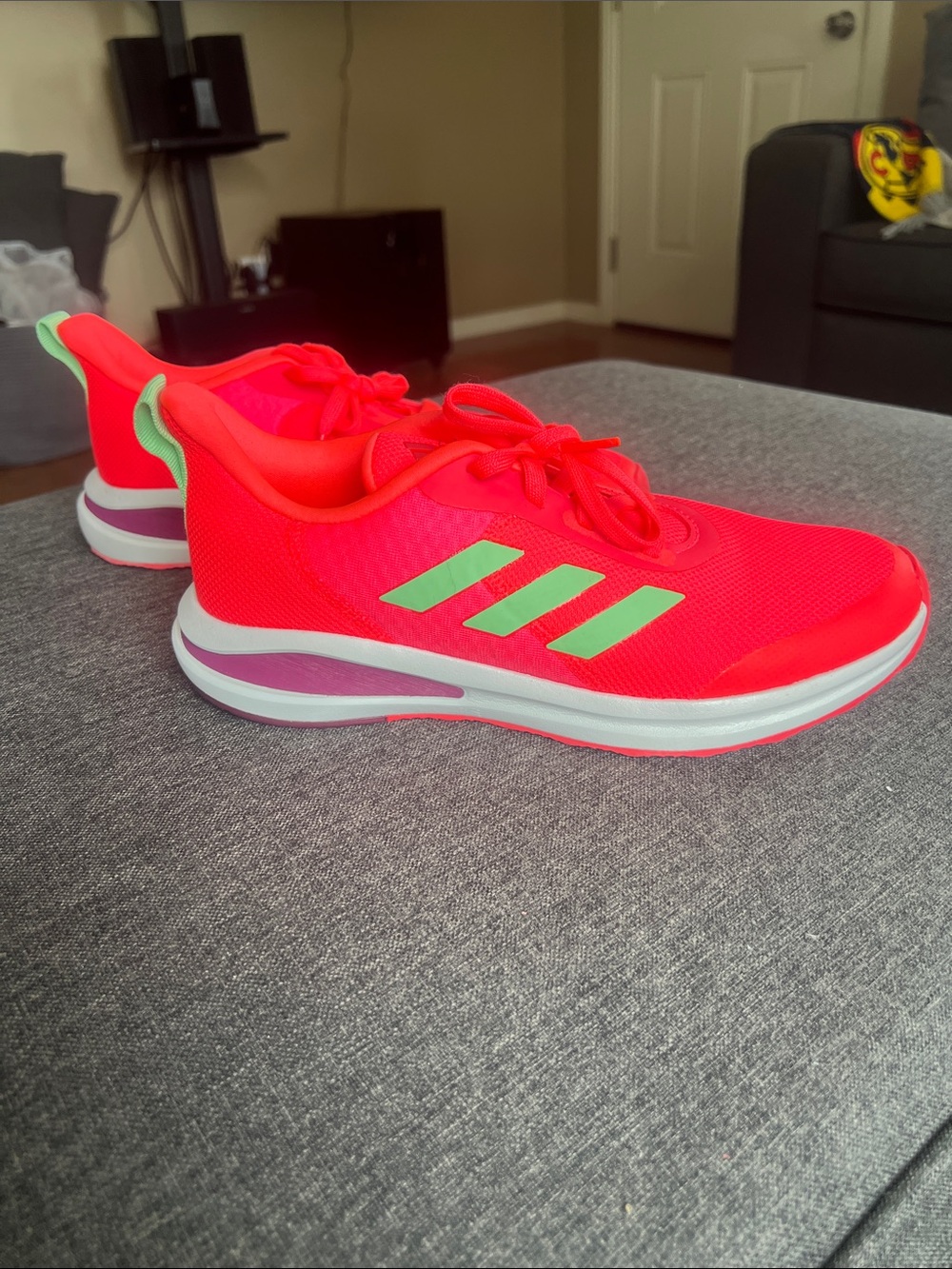 adidas women’s Bright Pink Sneakers